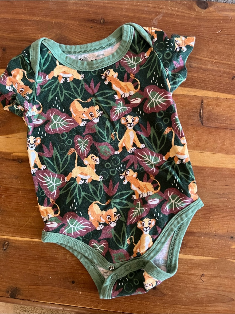 Her Universe Green and Tan Lion Cub Print Baby One-Piece Bodysuit